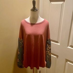 Boutique top with floral sleeves